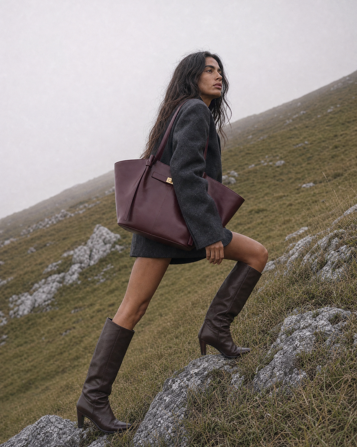 Woman on a misty hillside with The Aurore Wing in Bordeaux