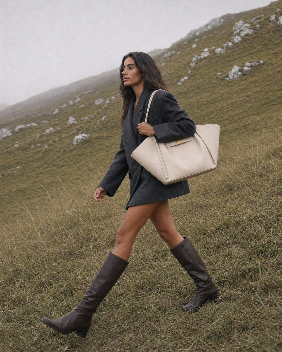 Woman on a misty hillside with The Aurore Wing in Écru