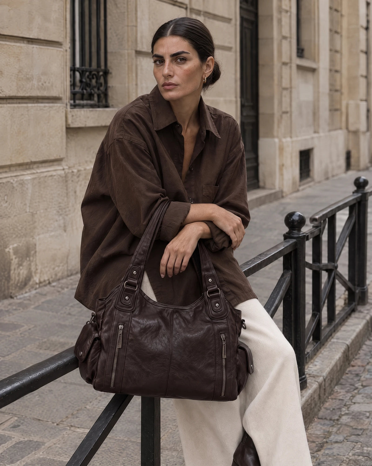 The Estran in Espresso, carried by its two shoulder handles
