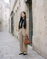 The Grève in Cognac carried by its top handles in a stone street