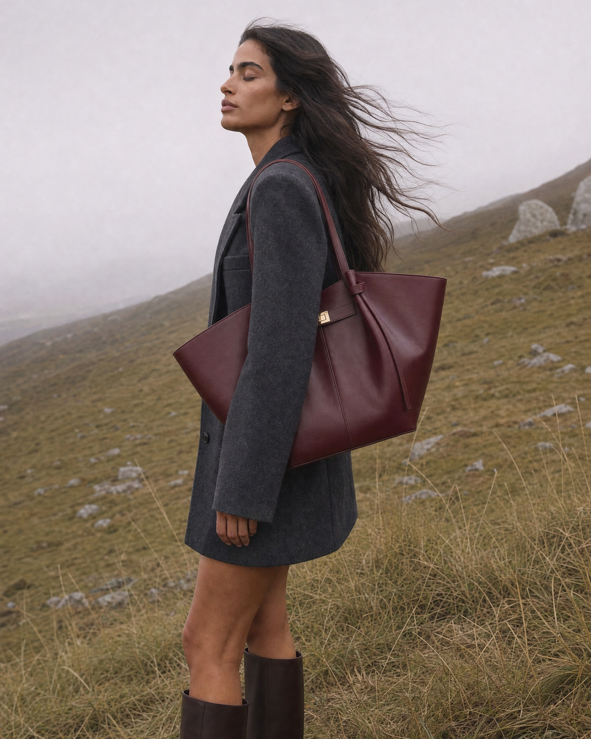 Woman on a misty hillside with The Aurore Wing in Bordeaux
