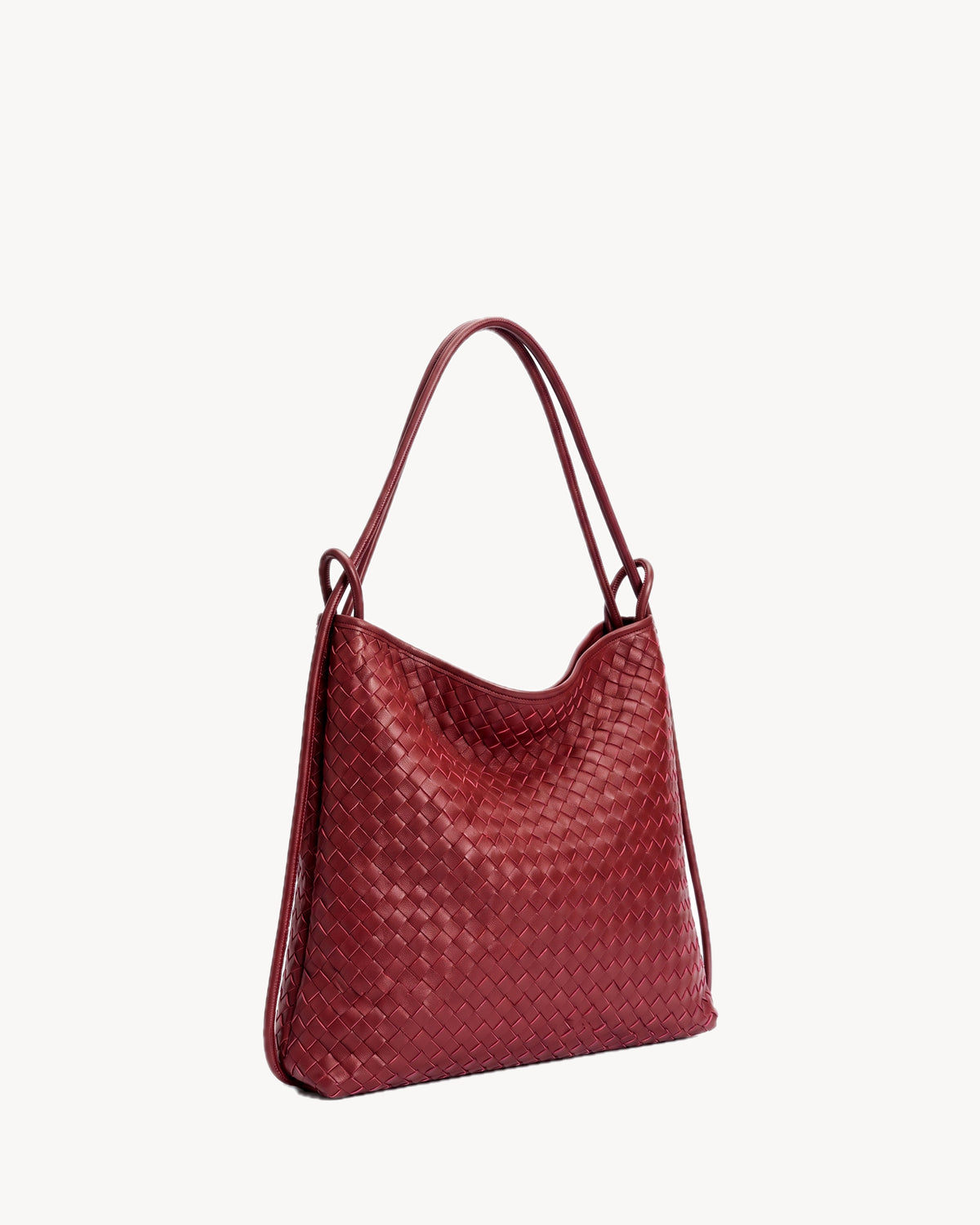 The Embellie in Bordeaux, burgundy woven leather convertible tote, three-quarter view