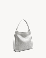 The Embellie in Écru, ivory woven leather convertible tote, three-quarter view