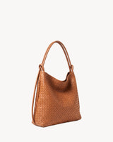 The Embellie in Cognac, tan brown woven leather convertible tote, three-quarter view