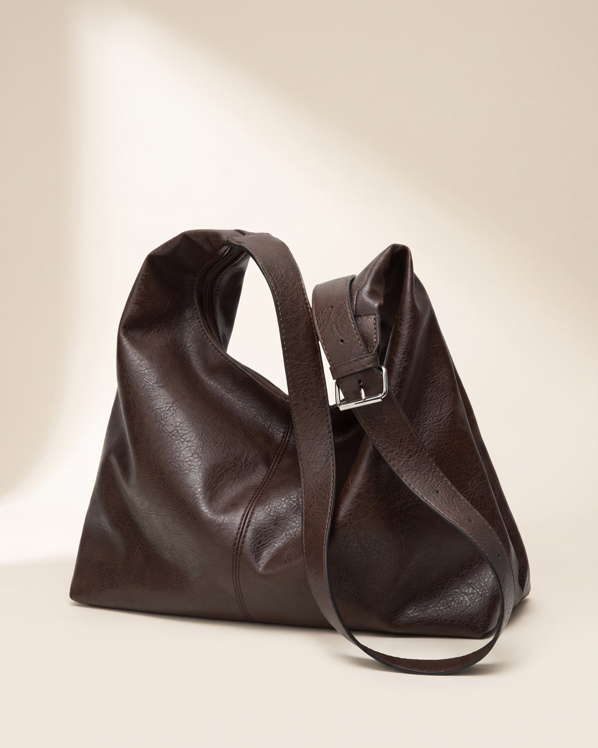 The Houle in Espresso, side view with adjustable strap