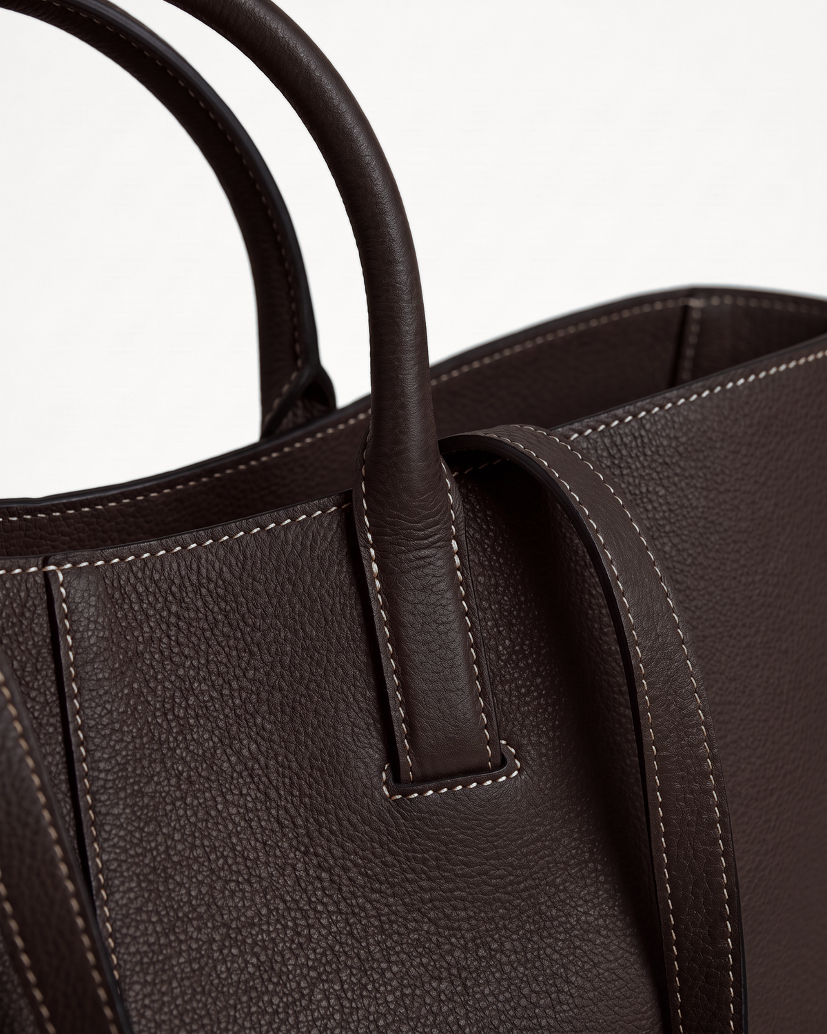 Close-up of the handle loop and topstitching of The Havre Wing in Espresso
