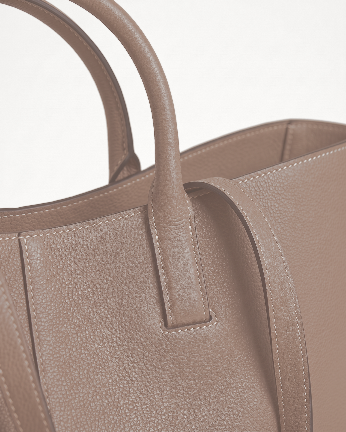 Close-up of the handle loop and topstitching of The Havre Wing in Sable