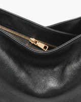 The Jusant Carryall in Noir, gold zip detail