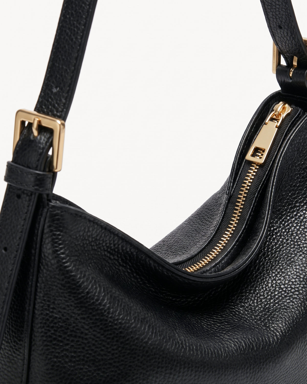 The Houle Petite in Noir, gold zip detail