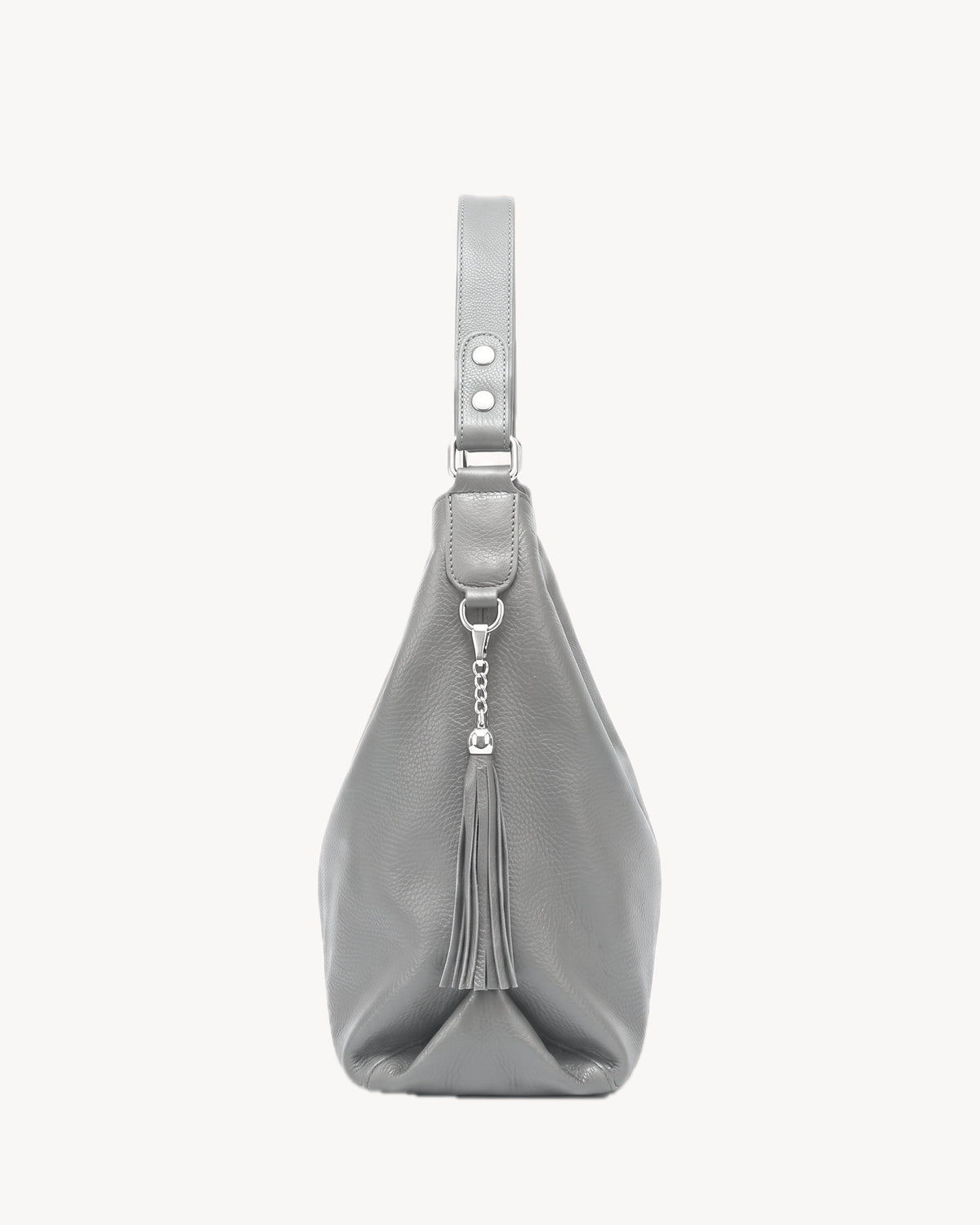 The Houle Soft in Galet, pebble grey pebbled leather hobo bag, side view with leather tassel