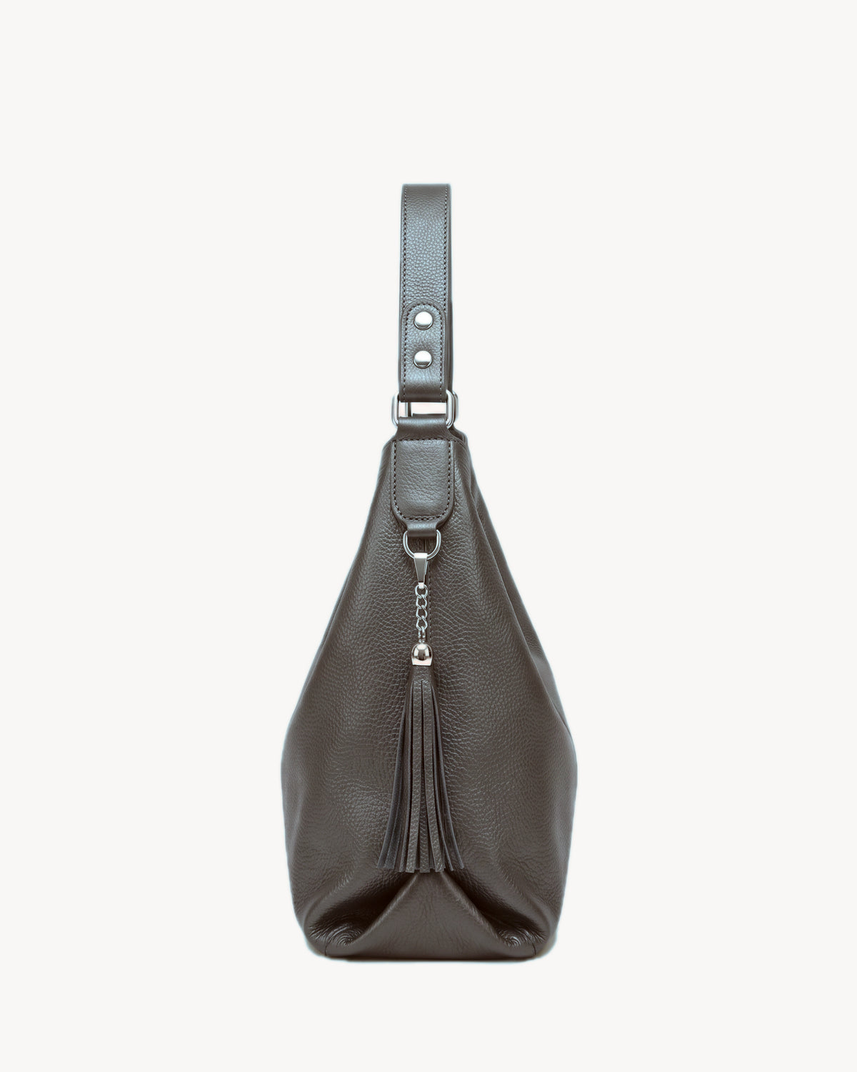 The Houle Soft in Bronze, pewter grained leather hobo bag, side view with leather tassel