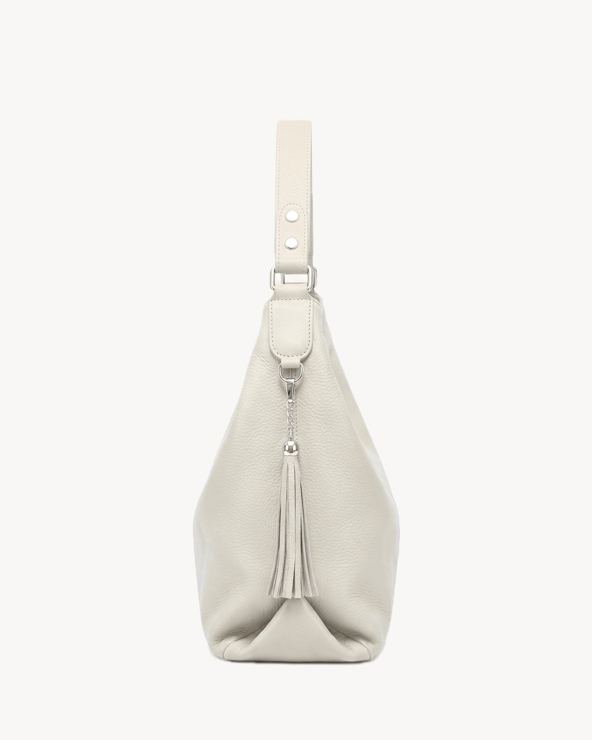 The Houle Soft in Sable, ivory sand pebbled leather hobo bag, side view with leather tassel