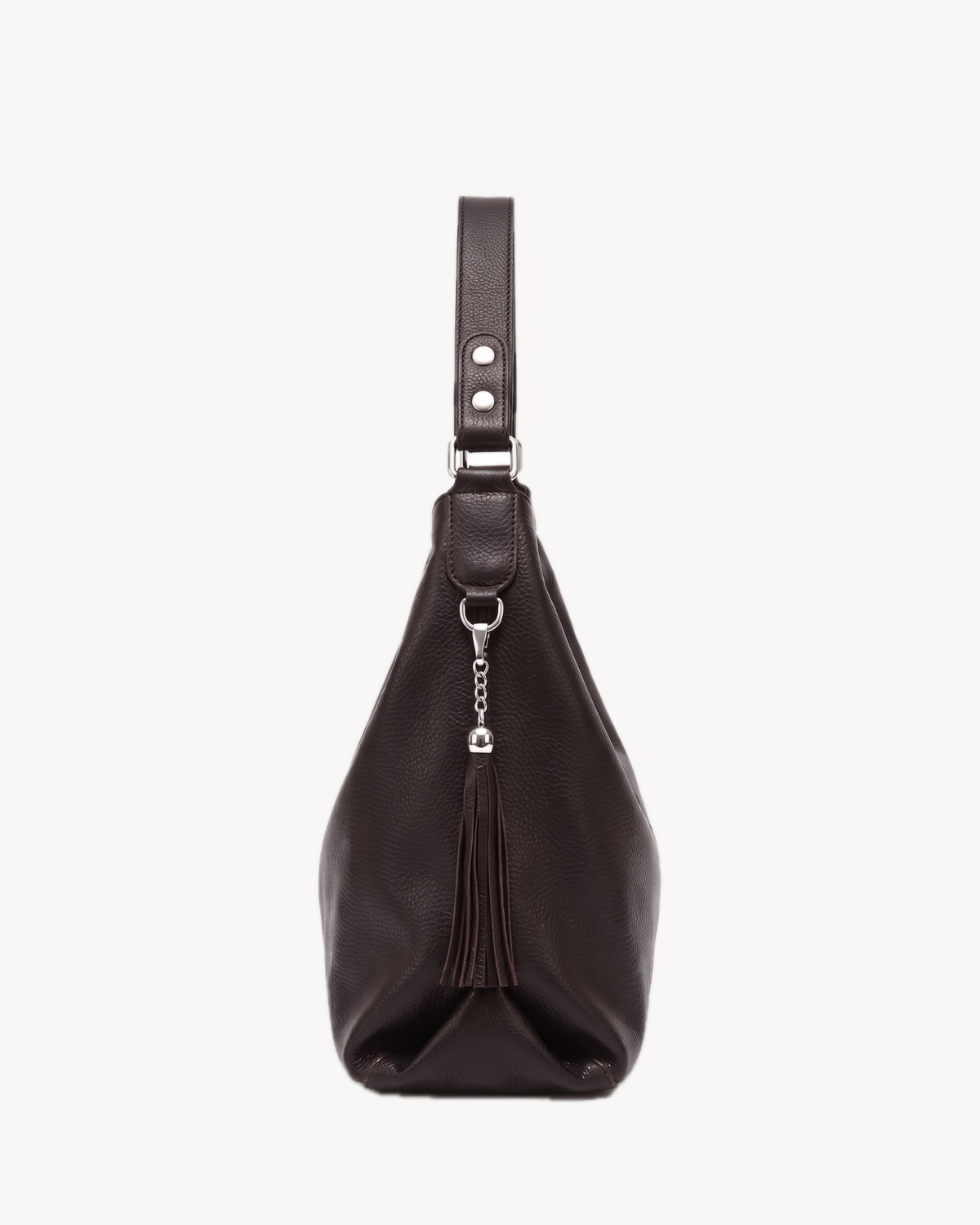 The Houle Soft in Espresso, espresso brown pebbled leather hobo bag, side view with leather tassel