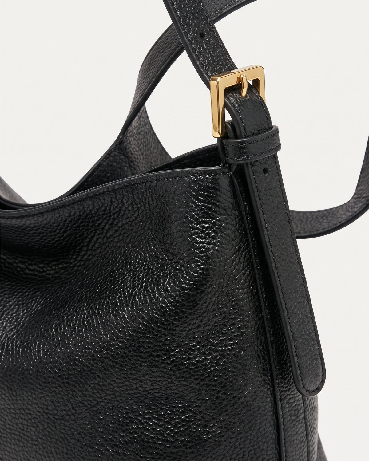 The Houle Petite in Noir, gold strap buckle detail