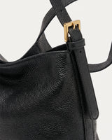 The Houle Petite in Noir, gold strap buckle detail