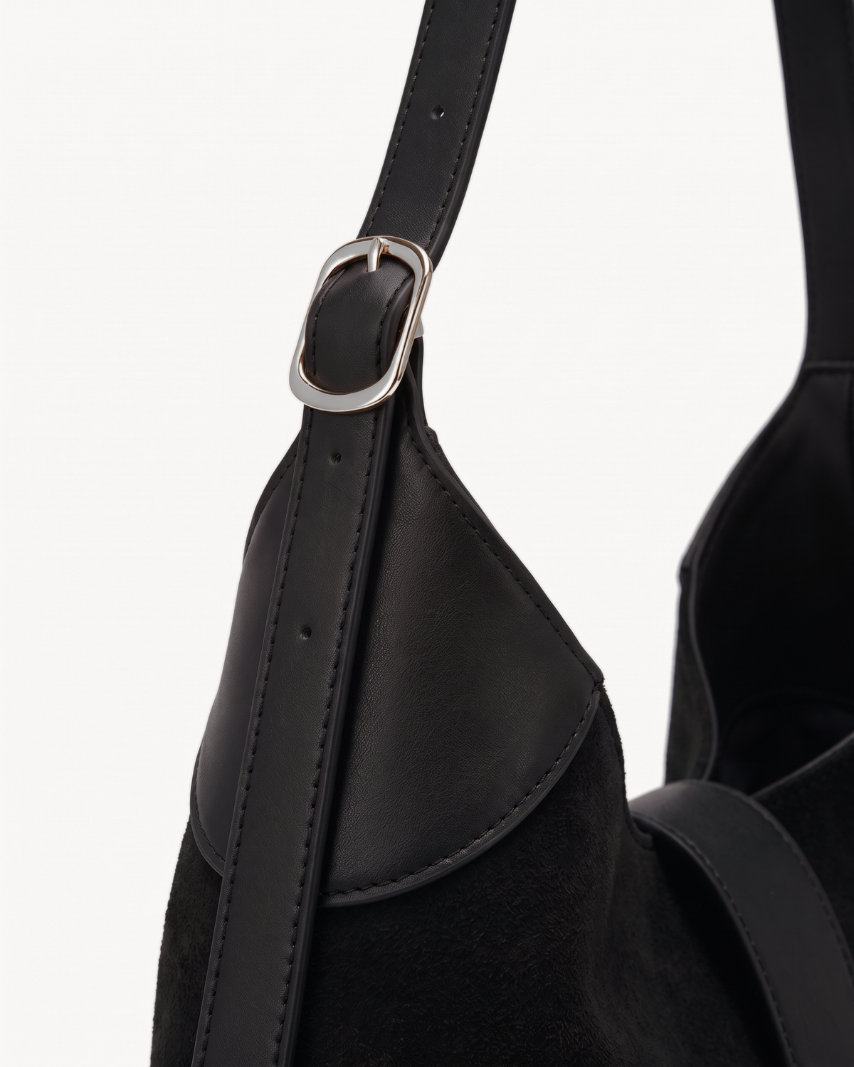 Close-up of the adjustable leather strap of The Brume Clip Hobo in Noir