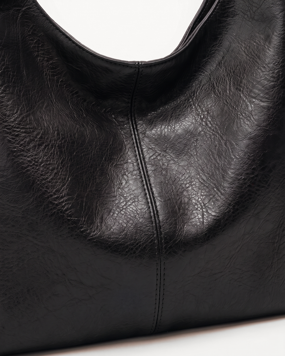 Close-up of the grain and center seam of The Houle in Noir