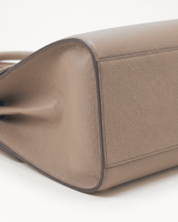Close-up of the pebbled side gusset of The Aurore Briefcase in Sable