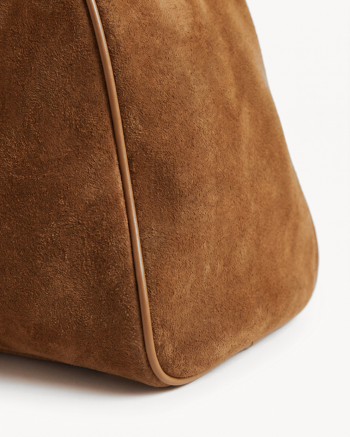 Close-up of the piped suede end of The Brume East-West in Tabac
