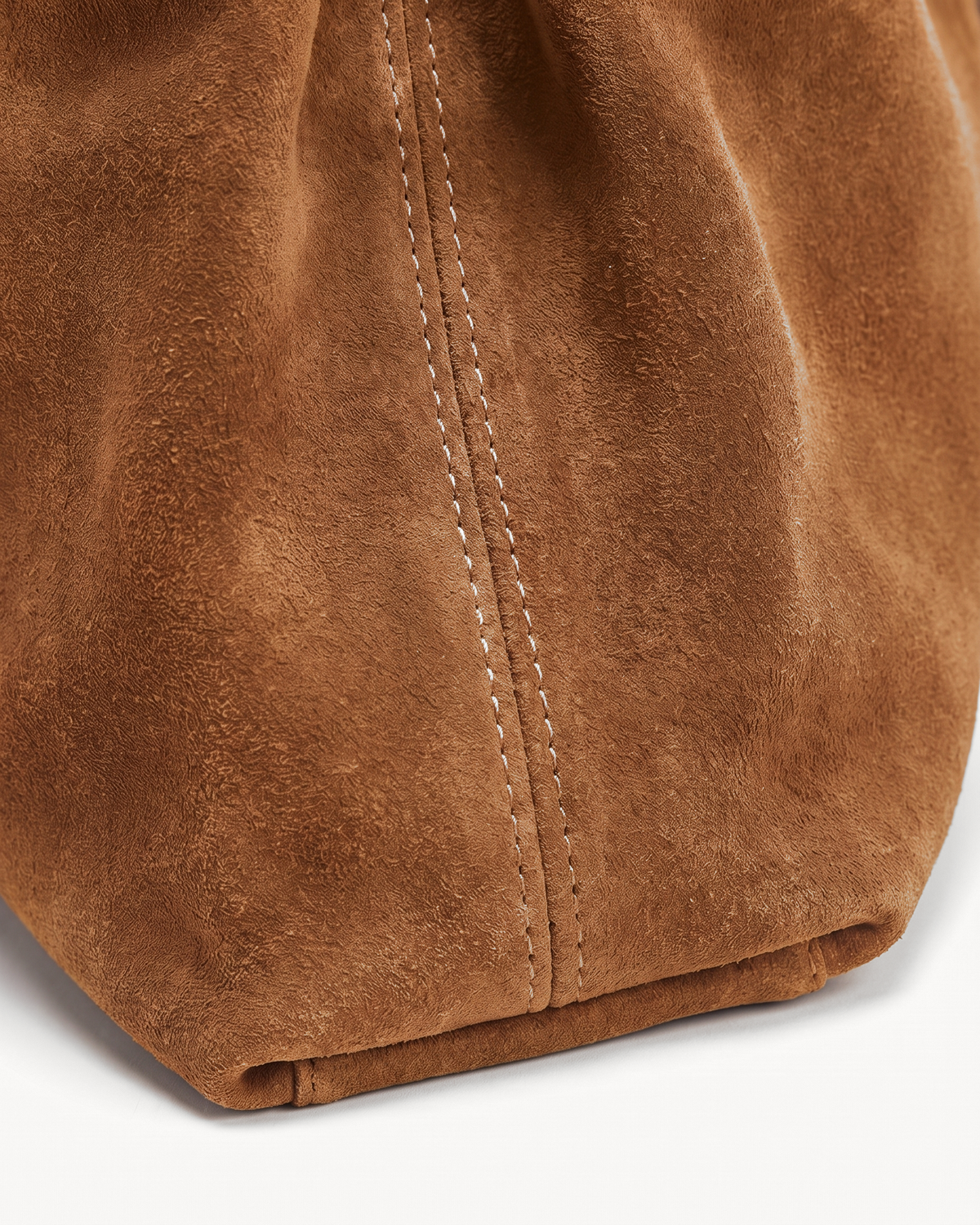 Close-up of the tabac suede nap of The Brume Belted Tote