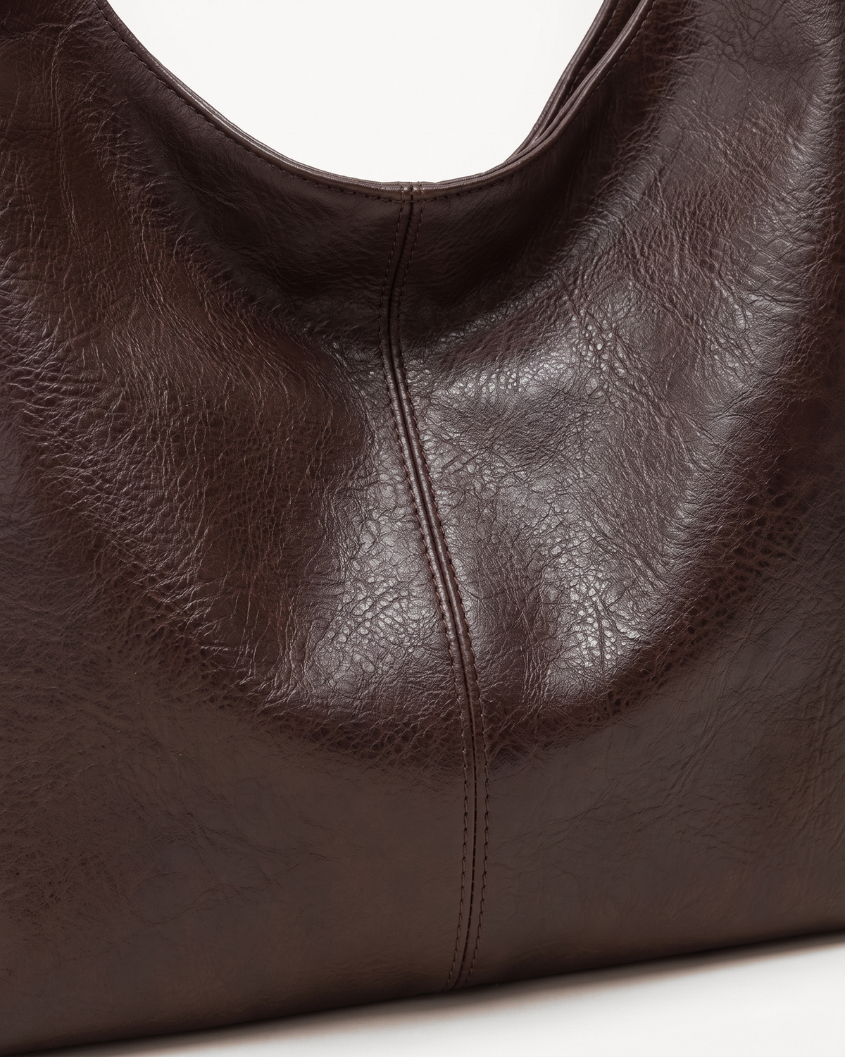 Close-up of the grain and center seam of The Houle in Espresso