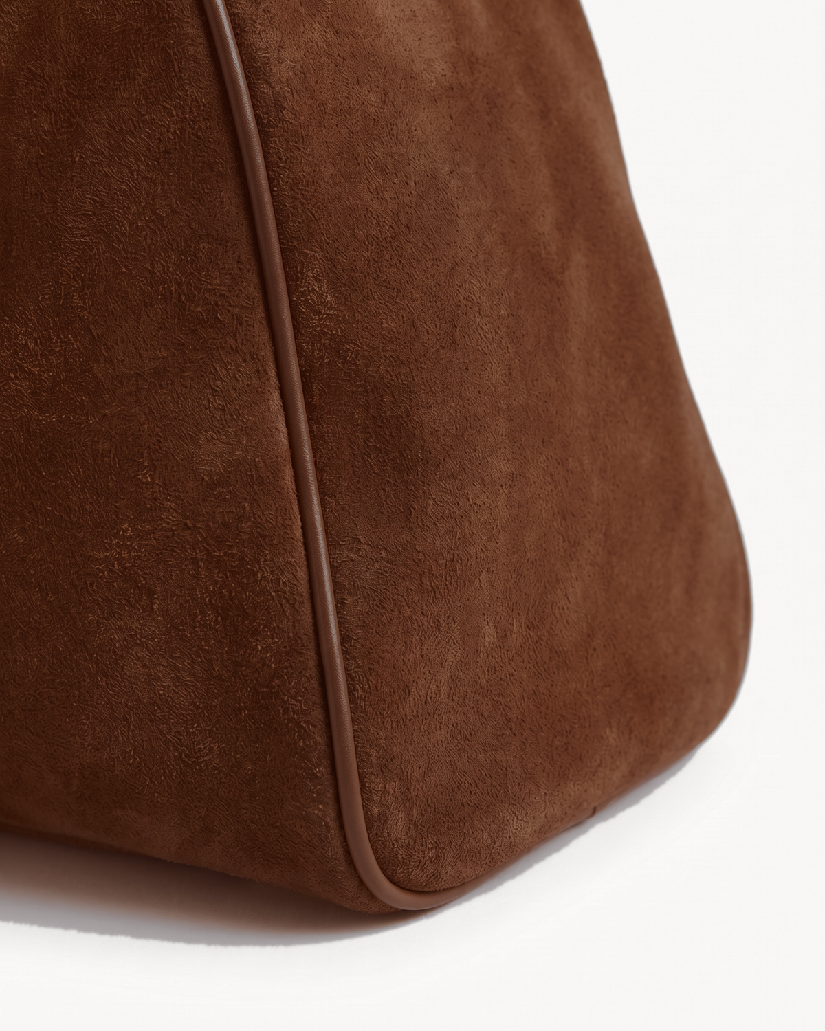 Close-up of the piped suede end of The Brume East-West in Chocolate