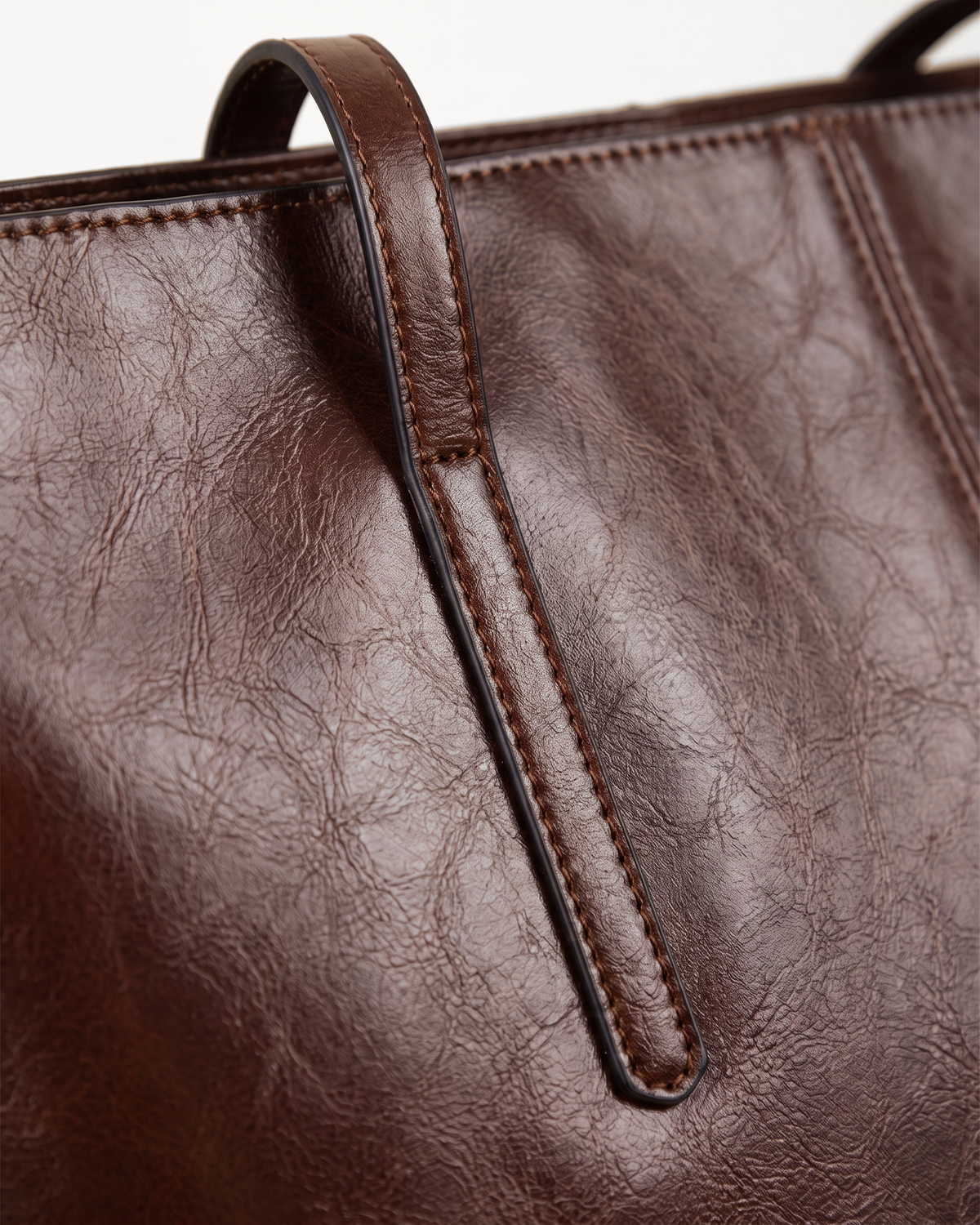Close-up of the strap, stitching and painted edges