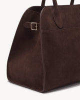 The Aurore Suede Satchel in Espresso, side strap with gold-tone buckle