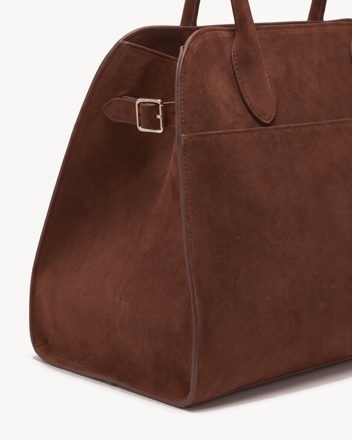 The Aurore Suede Satchel in Chocolate, side strap with gold-tone buckle