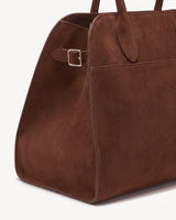 The Aurore Suede Satchel in Chocolate, side strap with gold-tone buckle