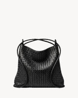The Embellie in Noir Mat, worn as a backpack: the cords pulled through the loops as shoulder straps