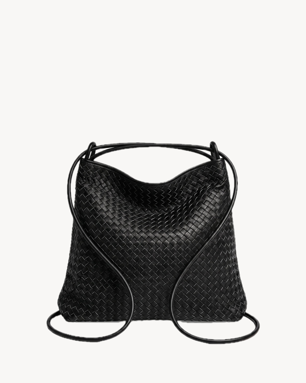 The Embellie Grand in Noir Mat, worn as a backpack: the cords pulled through the loops as shoulder straps