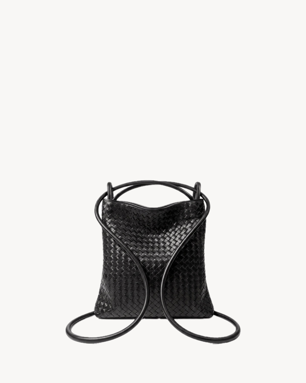 The Embellie Mini in Noir, worn as a backpack: the cords pulled through the loops as shoulder straps