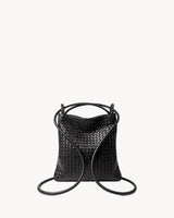 The Embellie Mini in Noir, worn as a backpack: the cords pulled through the loops as shoulder straps