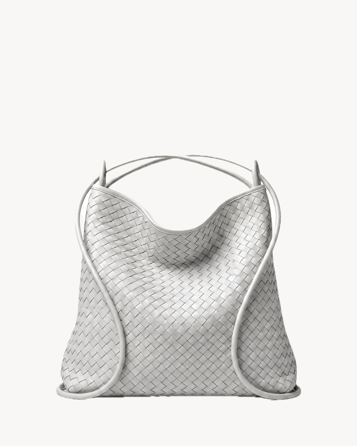 The Embellie in Écru, worn as a backpack: the cords pulled through the loops as shoulder straps