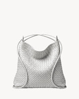 The Embellie in Écru, worn as a backpack: the cords pulled through the loops as shoulder straps