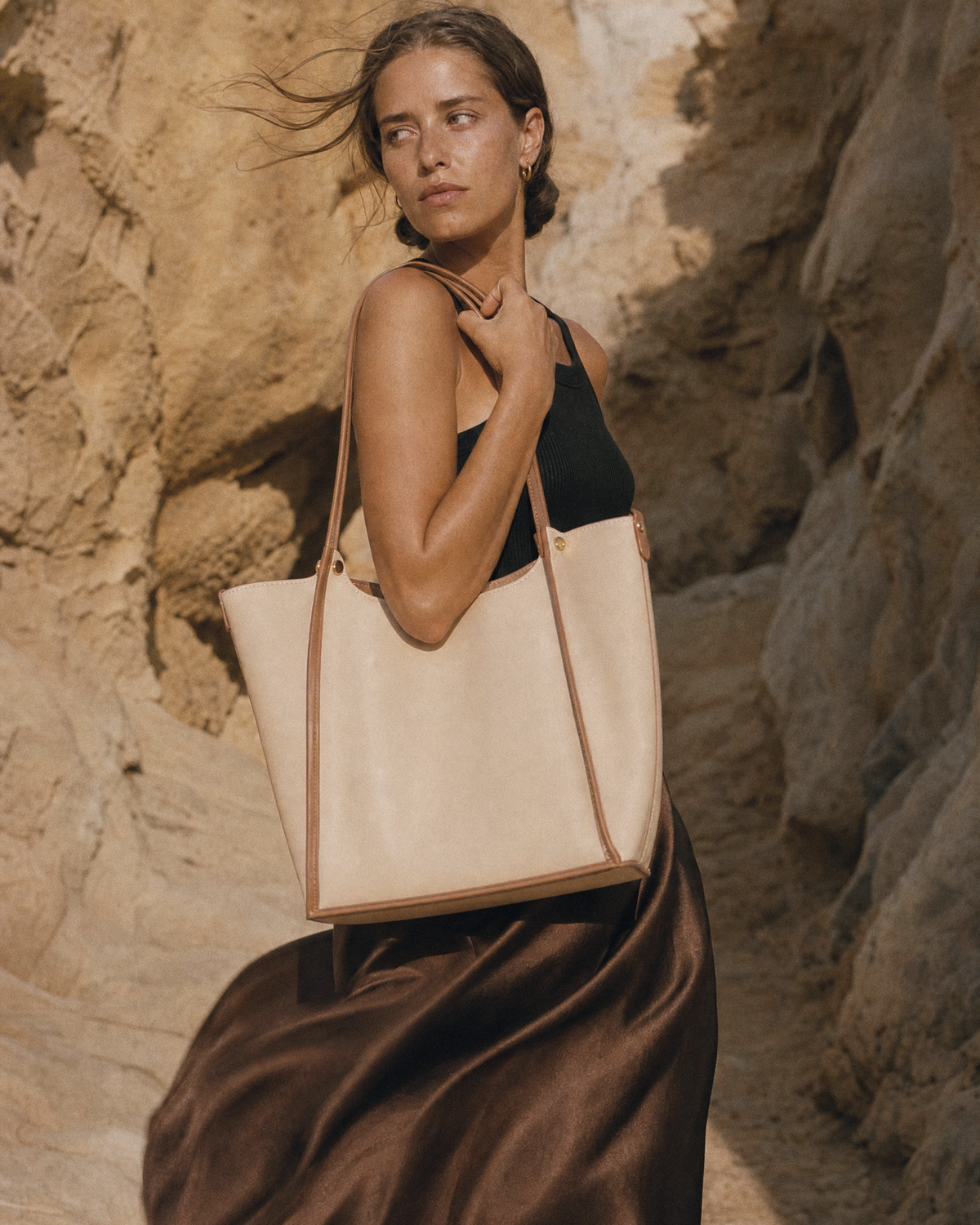 Woman in the wind with The Havre Buckle in Écru