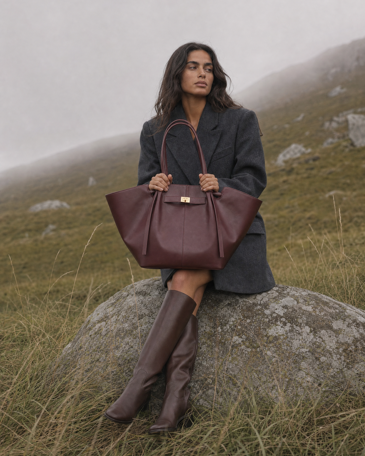 Woman on a misty hillside with The Aurore Wing in Bordeaux