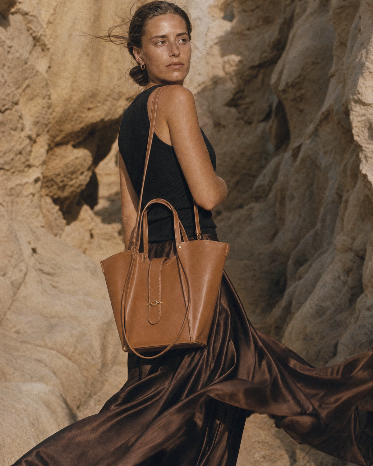 Woman in the wind with The Havre Buckle in Cognac