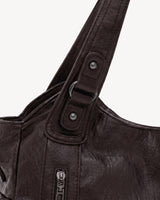 The Estran in Espresso, handle with riveted tab and gunmetal ring
