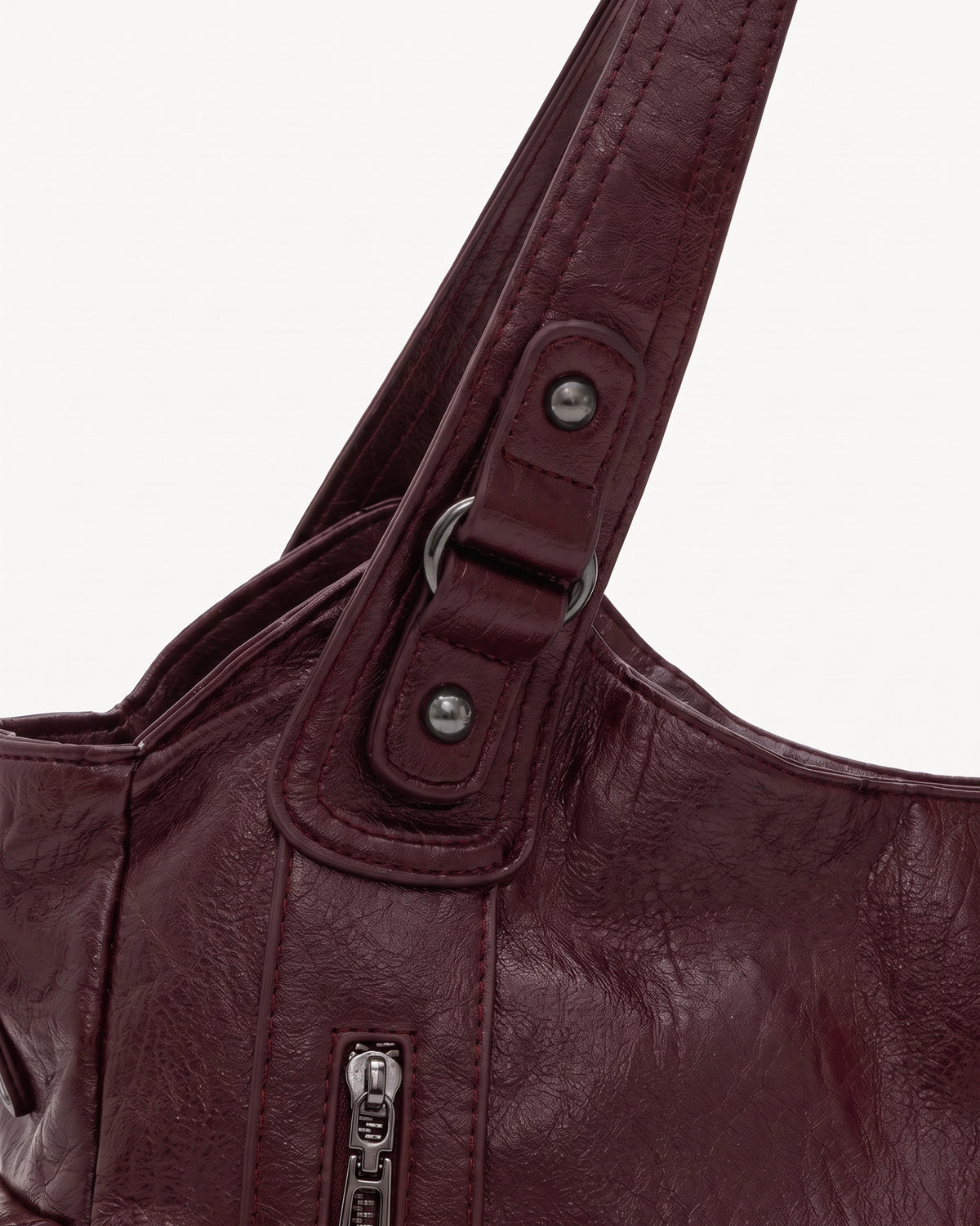 The Estran in Bordeaux, handle with riveted tab and gunmetal ring