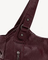 The Estran in Bordeaux, handle with riveted tab and gunmetal ring