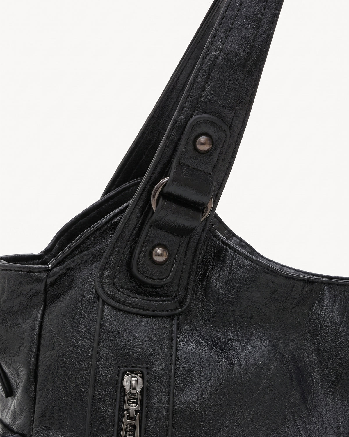 The Estran in Noir, handle with riveted tab and gunmetal ring