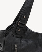The Estran in Noir, handle with riveted tab and gunmetal ring