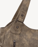 The Estran in Sable, handle with riveted tab and gunmetal ring