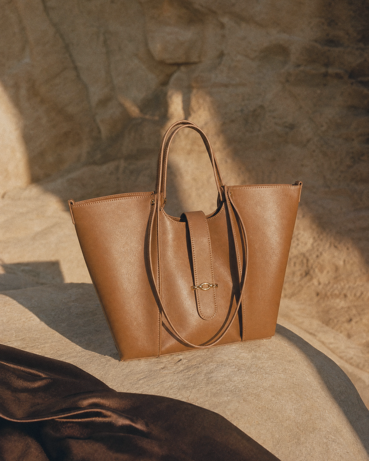The Havre Buckle in Cognac on a sandstone ledge