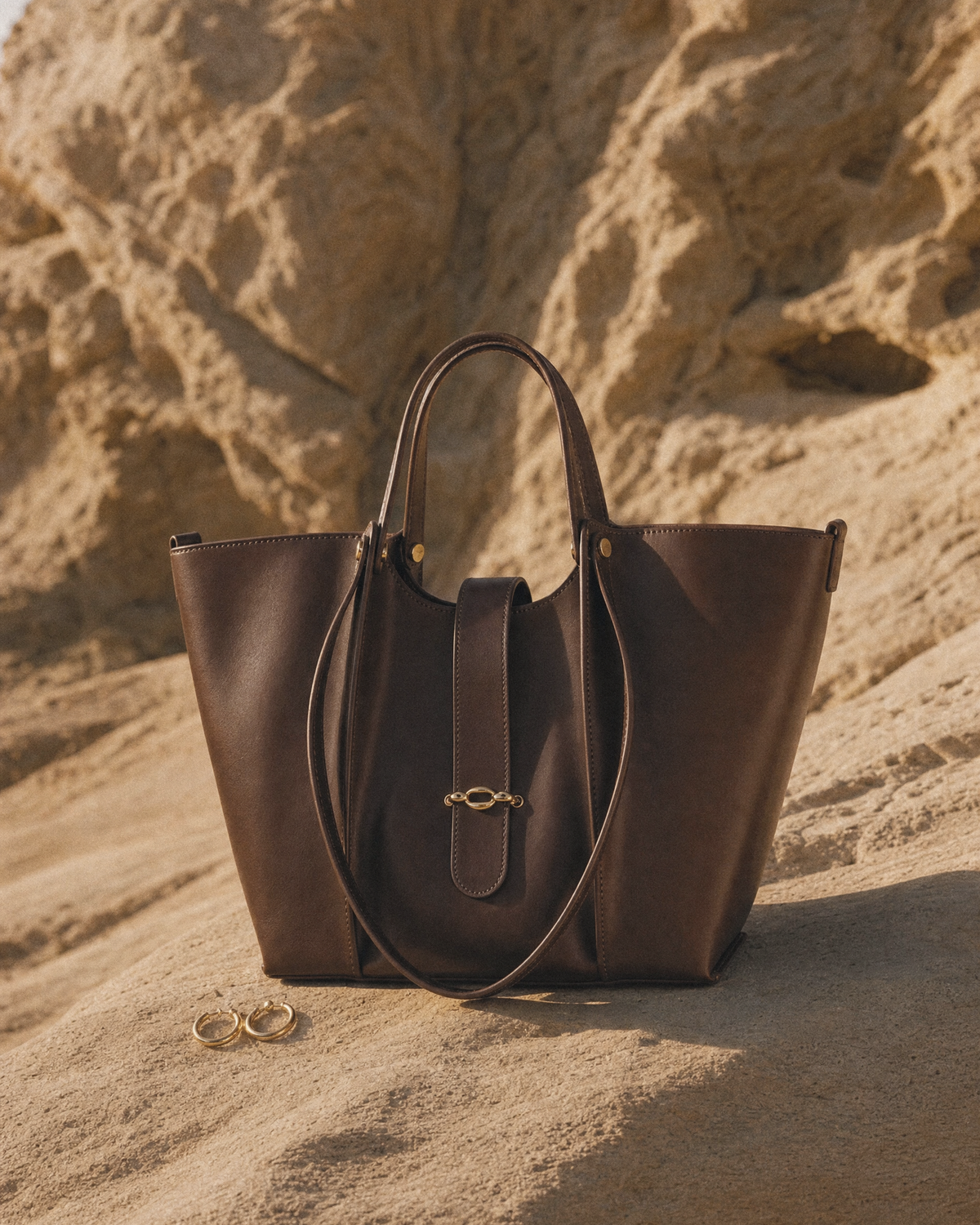 The Havre Buckle in Espresso on a sandstone ledge