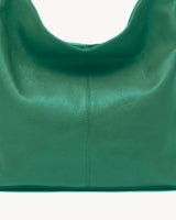 The Houle Soft in Forêt, close-up of the pebbled emerald green leather and centre seam