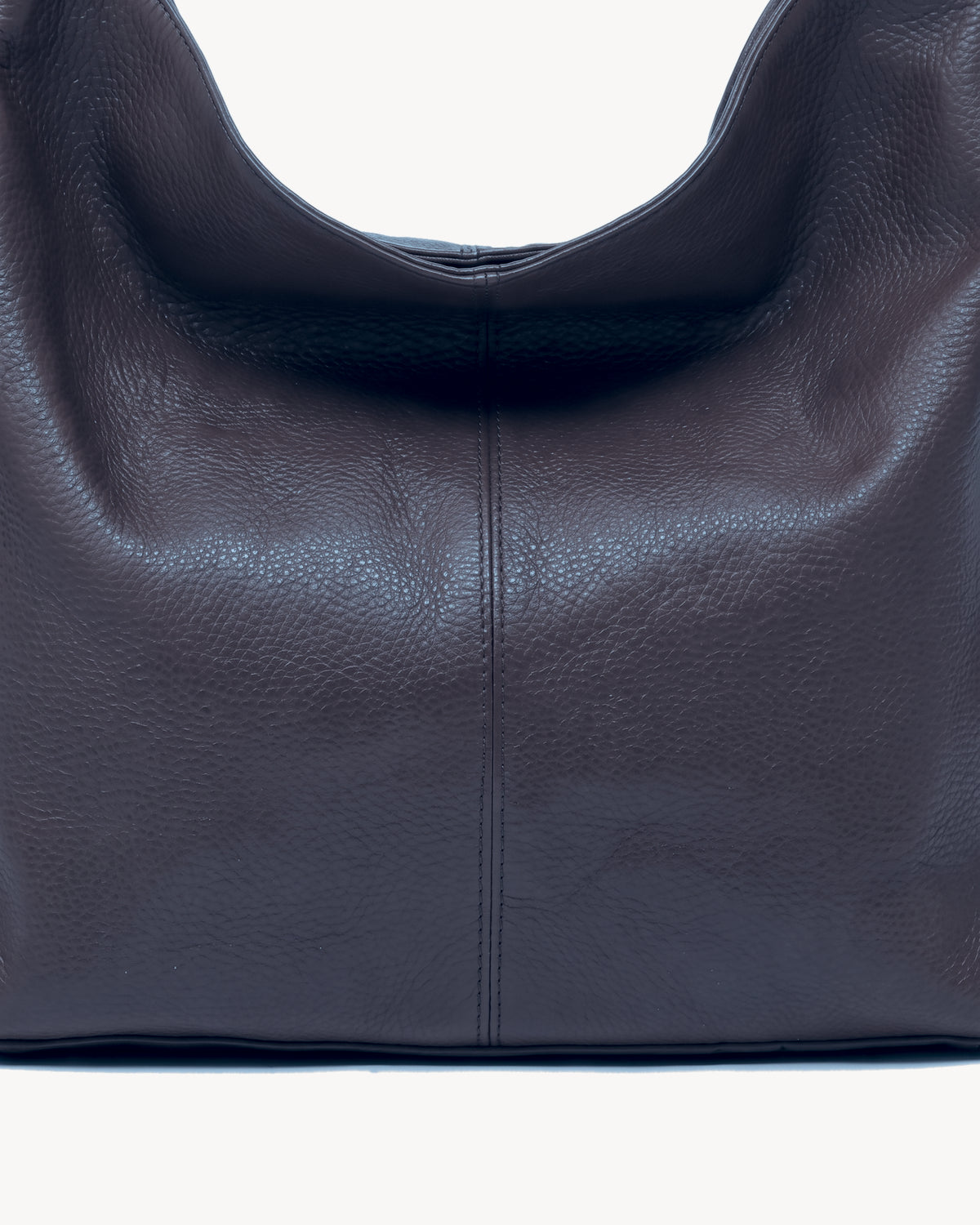 The Houle Soft in Nuit, close-up of the pebbled midnight navy leather and centre seam