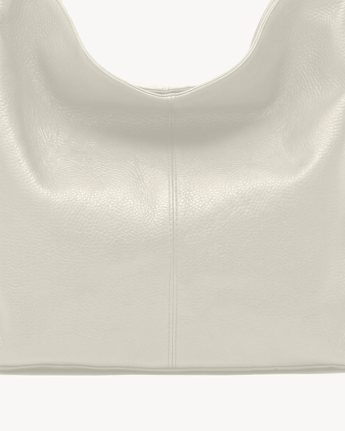 The Houle Soft in Sable, close-up of the pebbled ivory sand leather and centre seam
